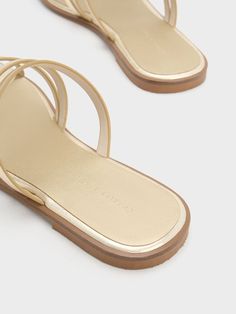 Jazz up your style and show off your pedicure with these eye-catching metallic gold slide sandals. Laid-back and casual, they will put the perfect finishing touch on your weekend and off-duty looks. Wear yours with flowy midi dresses and tailored shorts. Gold Slides, Flowy Midi Dress, Faux Leather Heels, Size Chart For Kids, Tailored Shorts, Charles Keith, Flat Pack, Asymmetrical Design, Midi Dresses