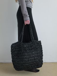 NOTHINGEVERYTHING is a brand that experiments with the diversity of materials.- This is a handmade knit big bag- Used two different textured materials- Used  polypropylene, an eco-friendly plastic material- Can be worn as a shoulder or tote bag Black Woven Plastic Bag, Eco-friendly Black Crochet Bag With Braided Handles, Eco-friendly Black Woven Shoulder Bag, Eco-friendly Black Tote Beach Bag, Eco-friendly Black Crochet Woven Bag, Eco-friendly Black Crochet Tote Bag, Black Woven Crochet Tote Bag, Black Eco-friendly Straw Shoulder Bag, Eco-friendly Black Bags With Braided Handles