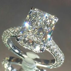 an engagement ring with a princess cut diamond