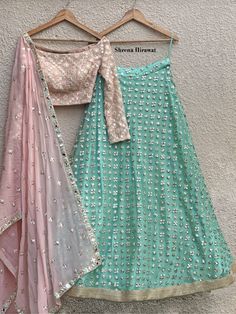 This baby pink blouse in georgette with mirror work detailing is teamed with an aqua mint mirror work lehenga. This outfit is completed with a georgette pink dupatta with mirror butis and embroidered border. Black Salwar, Mirror Blouse, Baby Pink Blouse, Mirror Work Lehenga, Pink Dupatta, Simple Lehenga, Half Saree Lehenga, Indian Outfits Lehenga, Work Lehenga