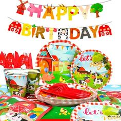 a birthday party set up with plates, cups and napkins for children's birthday