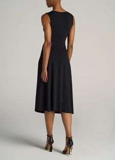 About Our Tall Women's Sleeveless Knot Front Dress Your casual companion to brunches, boardwalks and weekend getaways. This tall women's dress combines a breezy, sleeveless shape with a midi-length skirt that sits just right. Thanks to an elegant knot detail at the waist, it has an A-line shape that flatters your figure and fits it properly. It's made with a stretch-infused poly blend that's been shrinkage controlled, because it's hard enough to find tall dresses without worrying about losing le Black Sleeveless Fit And Flare Midi Dress, Flattering Fit And Flare Sleeveless Midi Dress, Sleeveless Fit And Flare Midi Dress For Beach, Sleeveless Maxi Dress With Flattering Silhouette For Summer, Casual Sleeveless Midi Dress With Flattering Silhouette, Flattering Black Sleeveless Midi Dress, Black Sleeveless Dress With Flattering Silhouette For Summer, Black Sleeveless Dress With Flattering Silhouette, Flattering Black Maxi Dress For Summer