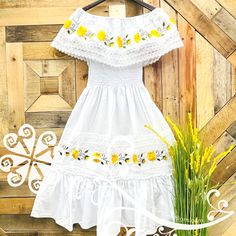 Bohemian Cotton Embroidered Dress For Garden Party, Bohemian Cotton Embroidered Dress With Lace Trim, Bohemian Embroidered Cotton Dress With Lace Trim, Yellow Cotton Dress With Ruffle Hem, Cotton Vacation Dresses With Floral Embroidery, Cotton Peasant Embroidered Beach Dress, Summer Cotton Dress With Embroidered Hem, Summer Sundress With Embroidered Hem, Spring Cotton Peasant Dress For Vacation