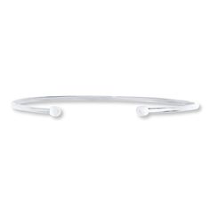 This stylish 14K white gold cuff bracelet for her features a small cylinder capping each end. Classic Cuff Bracelets With Polished Finish, Elegant White Gold Cuff Bangle, Classic Adjustable Bracelet With Open Band, Classic Adjustable Open Band Bracelet, Minimalist White Sterling Silver Bangle, Classic White Gold Cuff Bracelet, Minimalist White Gold Diamond Bracelet With Polished Finish, Minimalist White Sterling Silver Bangle Bracelet, Minimalist White Gold Cuff Bracelet With Polished Finish