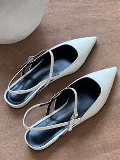 Editor's NoteLOIRET presents a practical style by adding minimal and feminine elements to the classic design.- Feminine pointed toe line- Buckle strap on the instep point- Flat styled slingback- Easy to put on and off with banding detail Measurements (in.)- Size: KR 220MM - KR 260MM (35 - 39)- Heel Height: 0.59 in.*Fits true to the size.Composition & Care- Cow Leather- Natural leather may have fine scratches and wrinkles- Bright leather can get stained by denim or dark outfits- Avoid direct White Single Toe Strap Kitten Heels, White Kitten Heels With Single Toe Strap, White Ankle Strap Slingback Sandals For Work, Classic Kitten Heels With Single Toe Strap, White Single Toe Strap Kitten Heels For Formal Occasions, White Pointed Toe Slingback Sandals With Branded Heel, White Pointed Toe Slingback Pumps For Work, White Flat Heel Slingback Pumps For Evening, Elegant Flat Heel Slingback Sandals With Strap