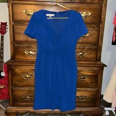 Vneck, Pleated In The Front, Size 8 32” Chest X 38” Long. Back Zipper. Attached Slip. You’ll Feel Absolutely Royal In This Dress. Blue Fitted V-neck Dress, Blue V-neck Short Sleeve Dress For Party, Dressy V-neck Lined Mini Dress, Blue V-neck Lined Midi Dress, Blue Dresses With Notched Neckline, Blue Midi Length V-neck Dress For Formal Occasions, Chic Blue Dress With Notched Neckline, Blue Midi-length V-neck Dress For Formal Occasions, Fitted Blue V-neck Dress