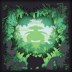 an image of a jungle scene made out of cut paper with animals and trees in the background