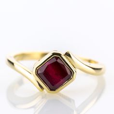 A piece from our collection, featuring a natural ruby of 2.0 carats set into a timeless yellow gold design.   Metal 14k / 0.585 gold Gemstones 1 ruby 2.0ct Measurements Head 9.0mm Shank 2.1mm Ring size 7 US Weight 3.8g Condition New General Information All items come with certificate of authenticity, gemstones have been tested at our lab if not otherwise indicated. Pendants are shown with chain for decorational reasons, please note that they do not come with a chain. Payment We accept payment th Ruby Birthstone Ring In Yellow Gold, Classic Ruby Diamond Ring In Yellow Gold, Formal Ruby Ring In Yellow Gold, Red Ruby Birthstone Ring Stamped 14k, Gold Emerald Cut Ruby Ring, Gold Emerald-cut Ruby Ring, Anniversary Ruby Ring In Yellow Gold, 14k Stamped Ruby Ring Round Cut, Ladies Ring