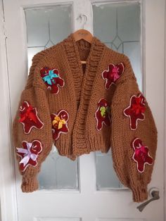 a teddy bear sweater hanging on the front door