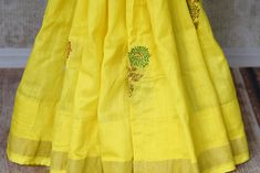 Bright yellow Muga Banarasi saree with floral zari buta for festive occasions. It comes with a matching blouse piece. Shop online at Pure Elegance or visit our store in USA. Disclaimer: The actual product may vary slightly from the image. These are custom orders, hence expect slight variation in color, placement of the motif or buta. ESTIMATED DELIVERYBecause this is a custom order, it would take about 4 weeks from the date of purchase. RETURN POLICYThis product is a custom order and cannot be returned or exchanged. Yellow Tussar Silk Anarkali Sets, Yellow Chanderi Saree With Resham Embroidery, Festive Yellow Tussar Silk Sets, Yellow Tussar Silk Lehenga With Cutdana, Yellow Tussar Silk Sets For Festivals, Yellow Anarkali Lehenga In Tussar Silk, Yellow Tussar Silk Sets For Diwali, Yellow Tussar Silk Lehenga For Designer Wear, Yellow Handloom Cotton Silk Sets