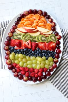 a platter with fruit arranged in the shape of a flag