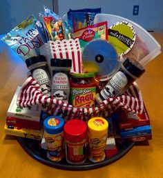 a basket filled with snacks and condiments on top of a wooden table