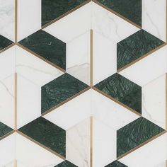 an abstract marble pattern with gold and green accents on the edges is featured in this image