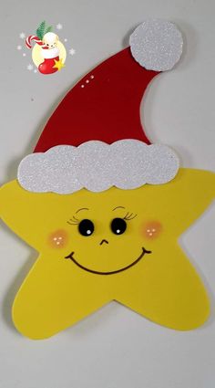 a yellow star with a red santa hat on it's head and a smiling face