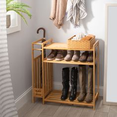 a wooden shoe rack with several pairs of boots on it