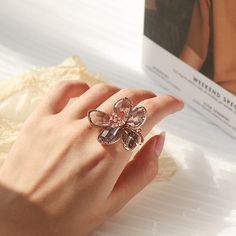 Floral Crystal Ring Rose Gold Metal Rings For Wedding, Rose Gold Flower Ring For Gift, Rose Gold Crystal Jewelry For Her, Rose Gold Flower Shaped Rings For Gift, Metal Crystal Ring As A Gift, Elegant Metal Flower Promise Ring, Elegant Adjustable Rose Gold Butterfly Ring, Adjustable Crystal Ring For Gift, Elegant Pink Crystal Ring