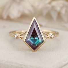 Experience the timeless elegance of our Kite Cut Lab Alexandrite Engagement Ring, set in vintage-inspired 14K solid gold with unique diamond accents. This exquisite ring features a captivating lab-grown alexandrite stone, known for its stunning color-changing properties, paired with sparkling diamonds. Perfect for engagements, weddings, promises, and anniversaries, this ring is a beautiful symbol of love and commitment. Timeless Emerald Diamond Wedding Ring, Timeless 14k Gold Emerald Wedding Ring, Heirloom Emerald Cluster Ring For Wedding, Heirloom Emerald Cluster Wedding Ring, Heirloom 14k Gold Cluster Ring For Wedding, Timeless Emerald-cut Birthstone Ring For Weddings, Emerald Cut Birthstone Ring With Diamond Accents For Wedding, 14k Gold Emerald Ring With Center Stone For Wedding, Timeless Emerald Cut Birthstone Wedding Ring