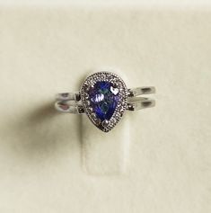 "Description Silver -925 Ring size:- 6 US Stone Name:- natural emerald and tanzanite Stone Size- 7x5 MM Stone shape:-l Pear Item No. D-42 \"Payment\" We Accept Payment Only Through PayPal\"Shipping \"Handling Time: We Take no handling time, We ship to Worldwide,Please make sure your shipping address is correct.Shipping Services: The shipping company takes business to deliver the product 7-13 days for International Shipping.,The Item will be shipped in safe and beautiful packing.Business day does Silver Teardrop Halo Rings, Silver Halo Teardrop Rings, Silver Setting Pear-shaped Emerald Promise Ring, Silver Pear-shaped Emerald Promise Ring, Pear-shaped Silver Emerald Promise Ring, Silver Teardrop Emerald Ring For Anniversary, Silver Pear-shaped Ring With Birthstone, Silver Pear-shaped Rings With Halo Detail, Silver Pear-shaped Halo Ring