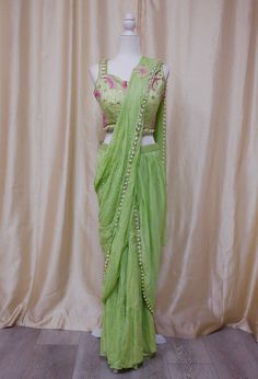 *Saree plus blouse set, prestitched and easy to wear  *Color: lime green, as pictured  *Indowestern Set  *Readymade: Bust 34, 36, 38 inches - please message us for size customization options! Bollywood Style Green Dola Silk Sets, Green Bollywood Dola Silk Sets, Green Dola Silk Bollywood Sets, Pista Green Georgette Pre-draped Saree For Navratri, Green Lehenga With Dori Work, Green Dola Silk Set With Pallu, Green Dola Silk Sets For Navratri, Green Dola Silk Set With Traditional Drape, Green Bollywood Choli With Dori Work