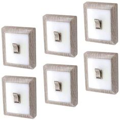 four light switch plates are shown in this image