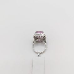 Beautiful 22.65 ct. pink kunzite emerald cut with 0.51 ct. good quality white diamond rounds.  Handmade in 18k white gold.  Ring size 7.5.  Metal:White Gold Stone: White Diamond,Kunzite Stone Cut: Emerald Cut  Dimensions reference the ring size and are not specific to the ring itself. Exact ring dimensions are not provided. Please reach in the seller Q&A for questions. Formal Pink Diamond Ring In Platinum, Formal Pink Sapphire Ring In Platinum, Luxury Pink Amethyst Ring For Formal Occasions, Luxury Pink Topaz Ring With Diamond, Luxury Pink Topaz Ring For Formal Occasions, Formal Pink Amethyst Ring, Luxury Pink Amethyst Ring With Prong Setting, Pink Baguette Cut Diamond Ring For Formal Events, Pink Platinum Ring With Gemstone