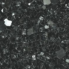 an image of glass that is very close to the ground in black and silver colors