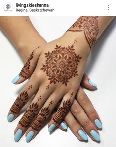 two hands with henna tattoos on them