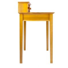 a small wooden table with a chair on it's back end and one leg up