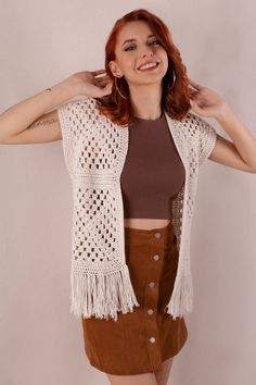 Casual Crochet Beach Top, Casual Beige Vest For Beach, Casual Beige Beach Vest, Casual Knit Vest For Beach, Bohemian Sleeveless Sweater Vest For Summer, Open Knit Sweater Vest For The Beach, White Sweater Vest For Summer Vacation, Bohemian Open Knit Vest For Summer, Bohemian Crochet Vest Top For Summer