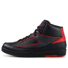 The Air Jordan 2 Retro 'Alternate 87' is a classic silhouette designed by Bruce Kilgore in 1986 and produced in Italy. Its sleek design features a black leather upper with Varsity Red accents, two iconic wings on the sides, and a rubber sole with Air Sole cushioning for stability and comfort. This timeless sneaker is perfect for any activity, and its iconic design is inspired by the Air Jordan series. With its classic look and superior comfort, the Air Jordan 2 Retro 'Alternate 87' is a must-have for any sneaker collection. (AJ2/SNKR) Classic Black Sneakers With Perforations, Fitted Sneakers For Streetwear With Round Toe, Casual Fitted Black Sneakers, Fitted Black Casual Sneakers, Jordan 2, Red Accents, Sneaker Collection, Silhouette Design, Classic Looks