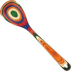 a wooden spoon with multicolored designs on it's side and a green circle in the middle