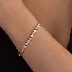 Wear this smart diamond tennis bracelet any time for a great touch of classic dazzle. Crafted in sterling silver with 14K rose gold plate, this enticing design features shimmering diamonds - artfully set to enhance size and sparkle - and beaded circles alternating with polished "S" shaped links. Captivating with 1/10 ct. t.w. of diamonds and a bright polished shine, this 7.25-inch bracelet secures with a tongue and groove clasp. Classic Rose Gold Tennis Bracelet For Formal Events, Rose Gold Diamond Tennis Bracelet With Jubilee Style, Timeless Rose Gold Diamond Bracelet With Prong Setting, Everyday Luxury Rose Gold Cubic Zirconia Tennis Bracelet, Elegant Rose Gold Tennis Bracelet For Anniversary, Timeless Rose Gold Tennis Bracelet, Fine Jewelry Rose Gold Tennis Bracelet With Prong Setting, Rose Gold Diamond Tennis Bracelet With Prong Setting, Rose Gold Tennis Bracelet With Prong Setting