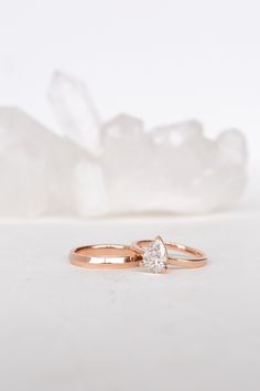 A creative minimalist. Classic form and a perfect shape are only accentuated by a clean and minimal stage. It's all about the space between. ﻿ An exquisite lab created diamond in rose gold. Rising about 1/4" above the finger, the overall effect is one of creative minimalism - this ring will be an heirloom for generations.The Lab created diamonds we use are ﻿sustainably grown aboveground in the Pacific North West, powered by the Columbia River. The facility is 100% hydro powered, meaning that it Minimalist Si Clarity Diamond Wedding Ring, Timeless 14k Rose Gold Wedding Jewelry, Timeless 14k Rose Gold Diamond Wedding Ring, Timeless 14k Rose Gold Wedding Rings, Minimalist Diamond Ring With Si Clarity, Minimalist 14k Gold Teardrop Ring, Minimalist 14k Rose Gold Jewelry With Brilliant Cut, Rose Gold Pear-shaped Ring With Brilliant Cut, Minimalist Rose Gold Diamond Wedding Ring