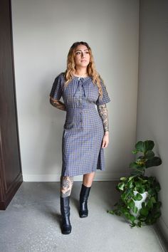 "ABOUT: Vintage 1950s/60s plaid cotton shirt dress with short sleeves and covered buttons at the center. This dress pulls over head and has a snap closure and decorative button with tie at the neckline.  It is unlined and in great condition for age, very classic. TAG: Caldwell Casuals TAG SIZE:  no size tag FITS LIKE: estimated at a modern small, please see measurements for details.  *NO REFUNDS IF ITEM DOES NOT FIT. IT IS BUYERS RESPONSIBILITY TO READ FULL MEASUREMENTS AND COMPARE TO A LIKE-GAR Vintage Plaid Short Sleeve Dress, Vintage Plaid Workwear Dress, Vintage Plaid Dress For Work, Retro Plaid Dress For Work, Fitted Plaid Dress With Buttons And Short Sleeves, Fitted Plaid Dress With Short Sleeves And Buttons, Vintage Style Gingham Plaid Short Sleeve Dress, Retro Short Sleeve Plaid Dress, Vintage Gingham Plaid Dress With Short Sleeves