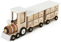 a wooden toy train with drawers and wheels