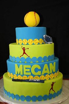 a three tiered cake with a softball on top and the words mecan printed on it