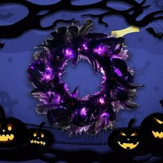 a wreath with purple lights in front of halloween pumpkins and bats on a blue background