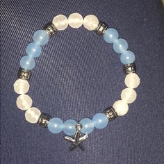 Never Worn! Blue And White Bracelet With Starfish Charm Blue Bracelets With Starfish Charm Ocean-inspired, Adjustable Blue Bracelets With Starfish Charm, Ocean-inspired Blue Starfish Bracelets, Casual Silver Star-shaped Bracelets, Casual Silver Star Bracelets, Casual Silver Star-shaped Bracelet, Blue Starfish Bracelets For Summer, White Starfish Bracelet With Ocean-inspired Style, Casual Blue Beaded Bracelets With Starfish Charm