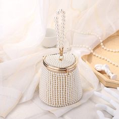 Shape: BucketMain Material: ABSOrigin: CN(Origin)Pattern Type: SolidStyle: FashionInterior: No PocketHardness: HARDClosure Type: HaspOccasion: PartyExterior: NONEDecoration: BeadingDecoration: ChainsLining Material: Polyester Bridal Clutch Purse, Pearl Clutch, Bridal Handbags, Motifs Perler, Pearls Diy, Pearl Bag, Bridal Clutch, Wedding Essentials, Pearl Design