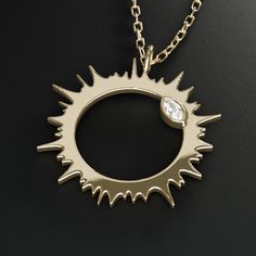 Also available without diamonds and sterling silver﻿. Solar eclipse corona jewelry Introducing the eclipse collection to commemorate the total solar eclipse of 2024. Featuring the solar corona and the "diamond ring" effect. About this piece This pendant necklace is made of 14K solid gold and marquise-cut diamonds. The charm is available in two sizes: 5/8" (16mm) and 7/8" (23mm). The necklace comes with a 16-18" length adjustable gold chain (other lengths available). Optional complementary engrav Solid Gold Charms, Space Jewelry, Total Solar Eclipse, The Eclipse, Marquise Cut Diamond, Small Charms, Solar Eclipse, Marquise Cut, Gold Charm