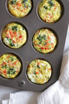 muffin tins filled with different types of food