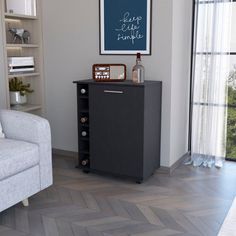 a living room with a couch, chair and book shelf