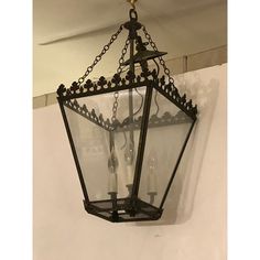 an old fashioned lantern hanging from the ceiling