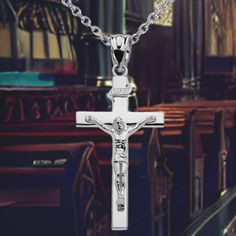 This unisex pendant charm is a stunning expression of faith, handcrafted from gleaming sterling silver with a beautiful banner inscribed above Jesus Christ on the holy cross. Choose from an 18" chain to complete this elegant accessory. Perfect for both men and women, this piece is sure to become a treasured addition to your jewelry collection. Spiritual Sterling Silver Cross Pendant Jewelry, Silver Crucifix Necklace With Polished Finish, Sterling Silver Crucifix Cross Necklace In White Gold, White Gold Sterling Silver Crucifix Necklace, Classic Sterling Silver Cross Charm, Silver Crucifix Necklace With Charms, Spiritual Polished Cross Jewelry And Charms, Sterling Silver Crucifix Necklace With Polished Finish, Sterling Silver Crucifix Charm Jewelry