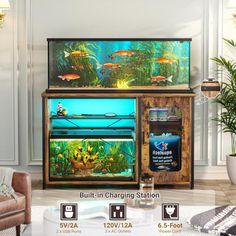 a fish tank sitting on top of a wooden cabinet in a living room next to a couch