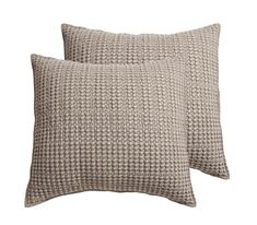 two pillows on a white background, one is brown and the other is beige with squares