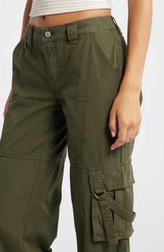 Keep it kicked back and carry on with trend-right cargo pants cut from sturdy cotton in a roomy fit. 32" inseam; 22" leg opening; 10" front rise; 14" back rise Zip fly with button closure Front slant pockets; cargo flap-patch pockets 100% cotton Machine wash, line dry Imported Cargo Pants In Store, Pink Cargo Pants, Pacsun Pants, Cotton Cargo Pants, Baggy Pants, Baggy Pant, Maternity Shops, Black Women Fashion, Loungewear Shorts