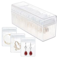 three pairs of jewelry in clear plastic cases