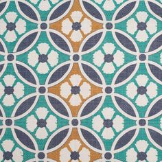 an upholstered pattern on fabric in blue, orange and white colors with circles