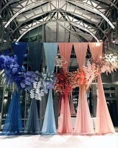 several different colored drapes with flowers in them